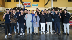 A substantial amount of Civic Helicopters’ flight training business involves instructing prospective helicopter pilots, like the group shown here with Chin Tu (in blue jacket) and Candise Tu (in puffer jacket), for South Korea’s military services. (Civic Helicopters Photo)